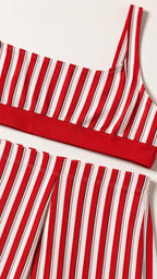 Close-up detail of red and white striped crop top and skirt waistband