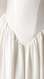 Close-up detail of bodice drop-waist gathering