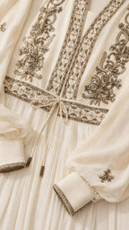 Close-up of bodice embroidery and cuffs on Ivory maxi dress