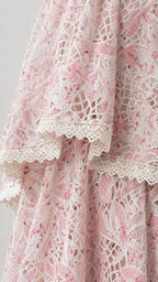 Close-up detail of floral lace pattern and scalloped hem