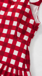 Close-up detail of red gingham fabric and side zipper