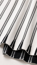 Close-up of knit texture on Black and White striped dress