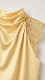 Close-up of fabric and lace trim detail on yellow dress