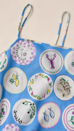 Close-up detail of blue printed fabric and straps