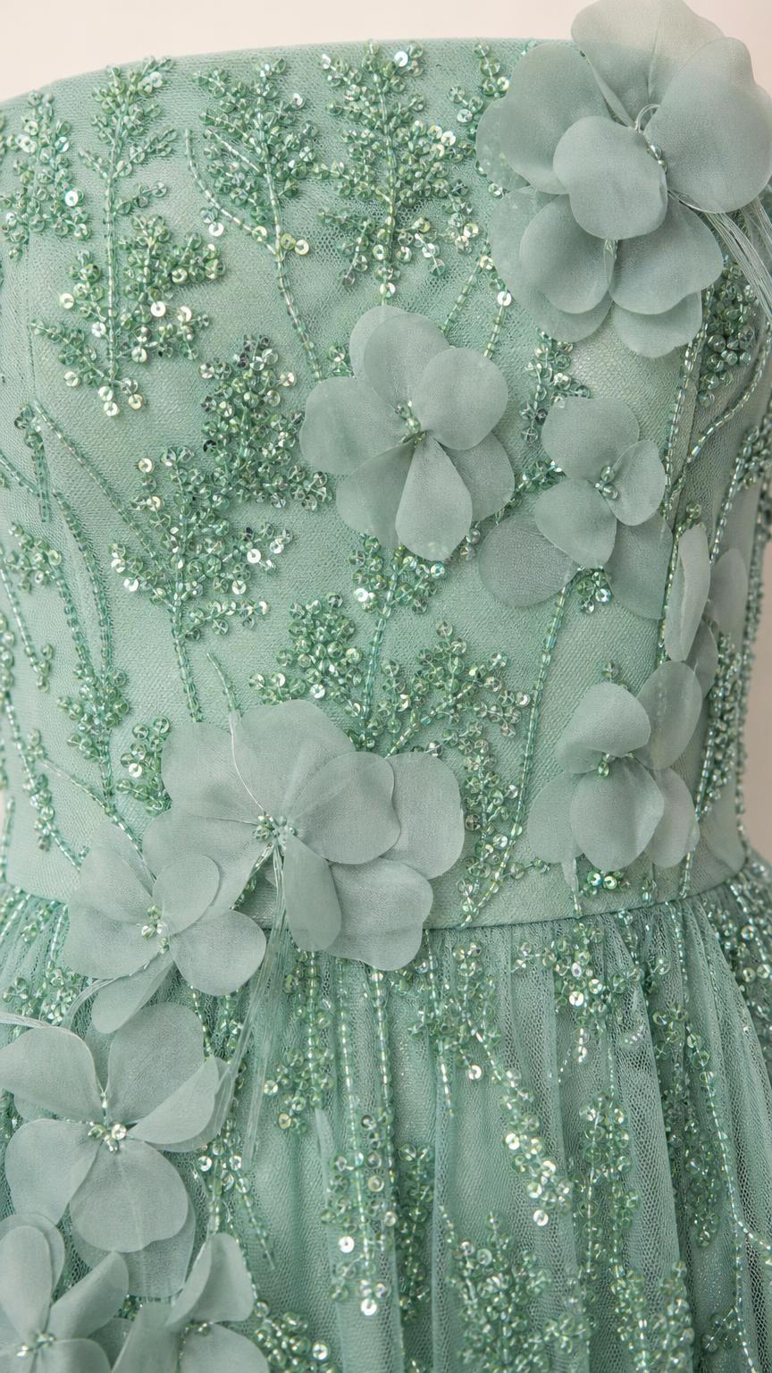 Close-up detail of floral appliques and beadwork