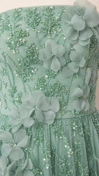 Close-up detail of floral appliques and beadwork