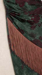 Close-up detail of floral velvet texture and fringe trim