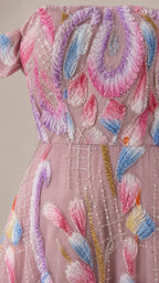 Close-up detail of embroidery on pink evening gown