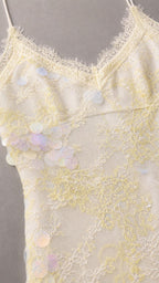 Close-up of the ivory floral lace overlay and delicate lace-trimmed neckline