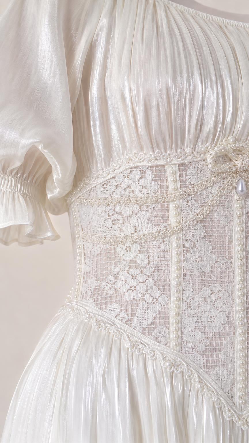 Close-up of lace corset waist and puff sleeve detail