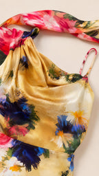 Close-up of cowl neck and matching neck scarf on yellow floral dress
