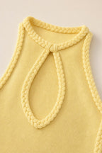 Close-up of braided keyhole neckline detail