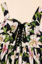 Close-up detail of lace-up square neckline and floral print fabric