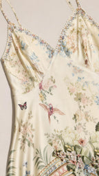 Close-up of bodice and print detail on ivory slip dress