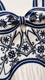 Close-up of bodice detail showing bow and intricate print