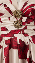 Close-up detail of the rhinestone brooch appliques and pleated bodice