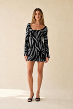 Front view of blue zebra print mini dress