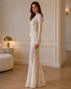 Side view of ivory lace peplum maxi dress with fitted silhouette