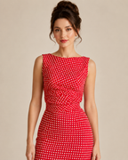 Close-up of red polka dot boat neck sleeveless dress bodice and waist ruching