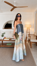 Side view of slate blue strapless flowing maxi dress