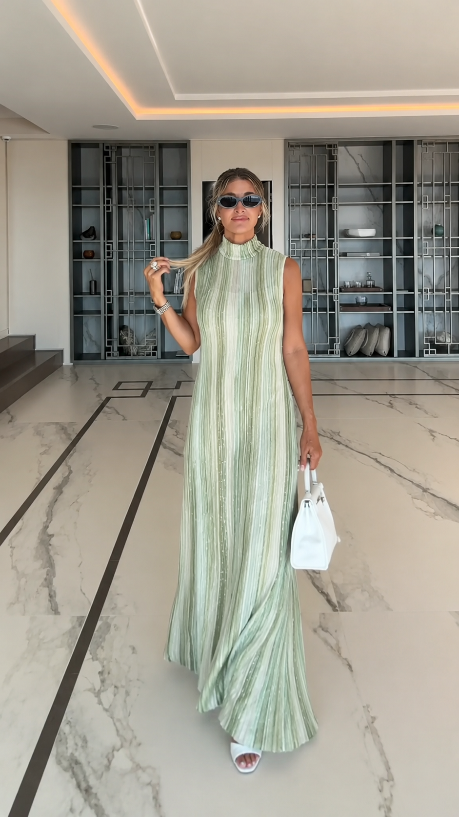 Front view of sage green pleated mock neck sleeveless maxi dress
