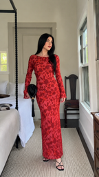 Indoor styling view of red floral long sleeve maxi dress
