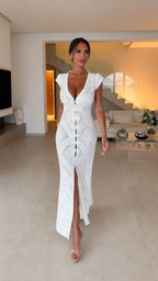 Model wearing white lace maxi dress, walking pose