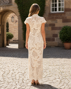 Back view of ivory floral crochet lace mock neck maxi dress