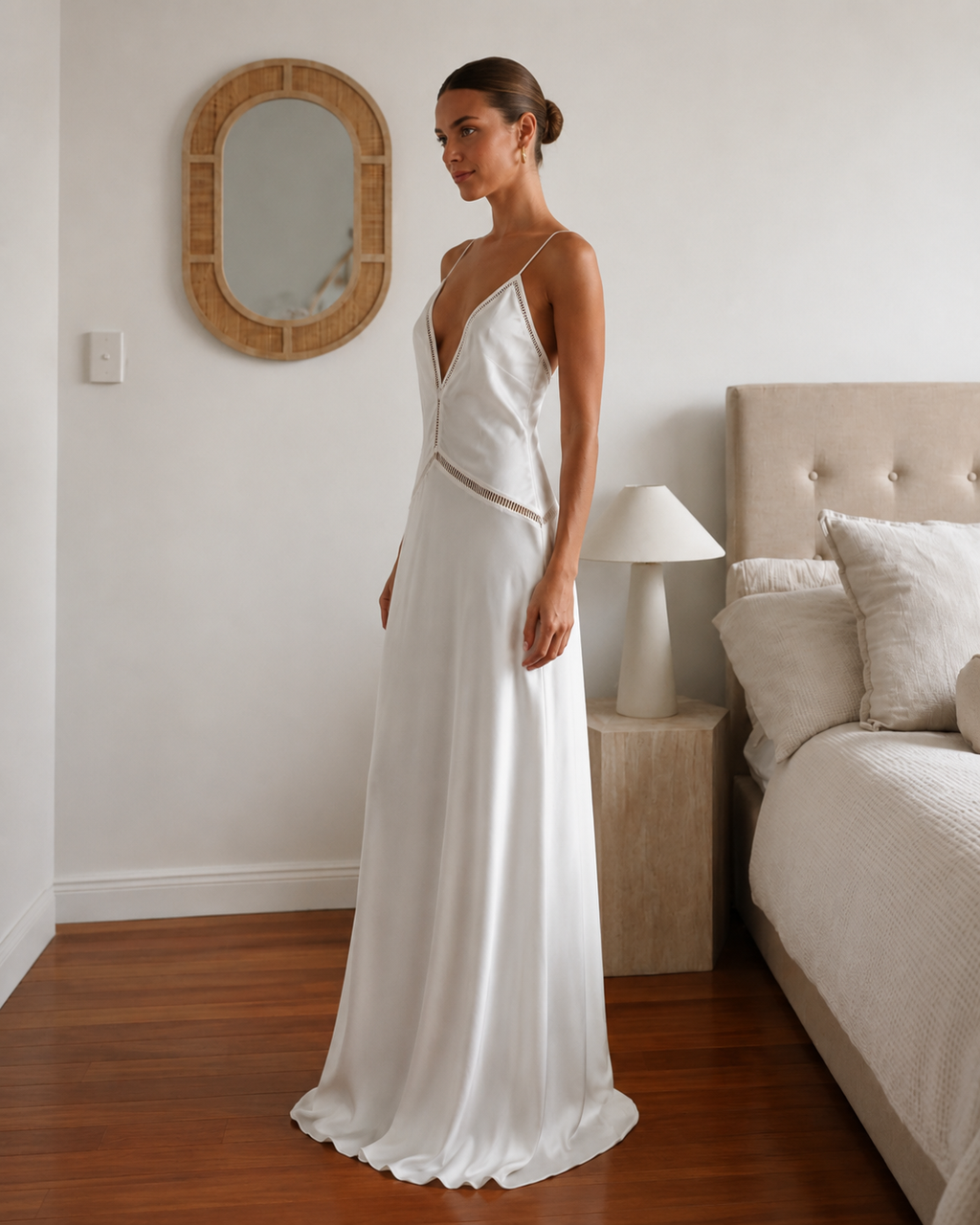 Side view of ivory satin-style maxi dress with plunging neckline