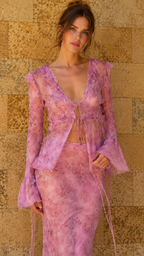 Close-up of model wearing lilac lace tie-front top